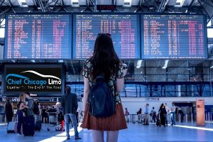 woman at airport waiting for limo