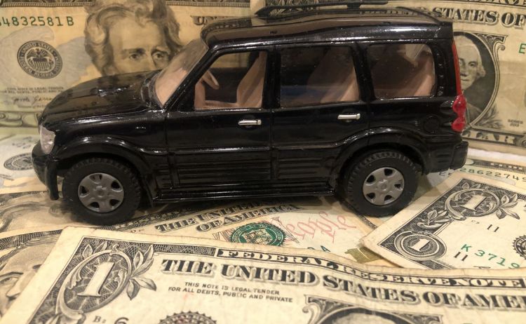 a car surrounded by dollar for chief chicago limo pay less