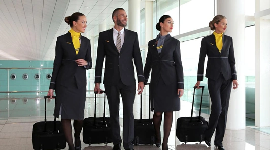 Uniformed flight crew heading to their next flight supported by Airline Crew Transportation Chicago
