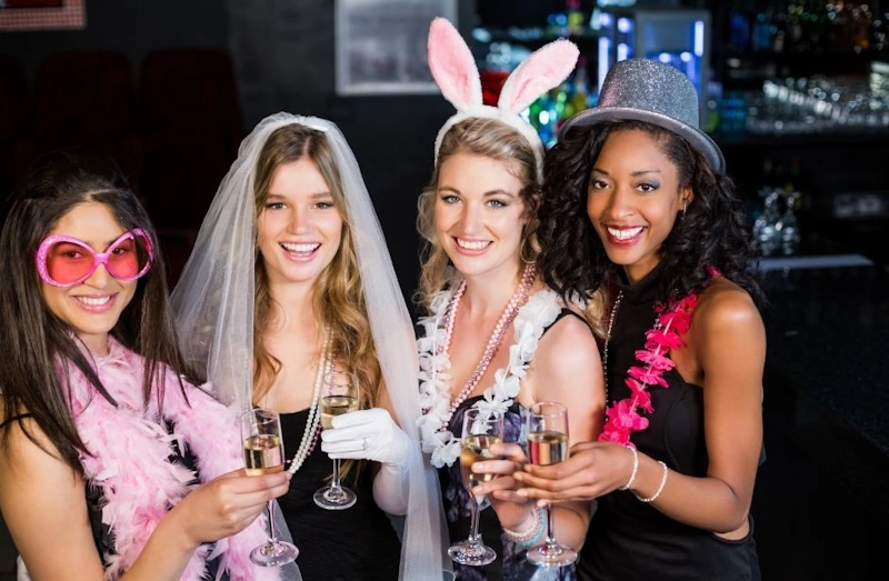 Four women enjoying a celebration before their ride with Bachelorette Party Limo Chicago