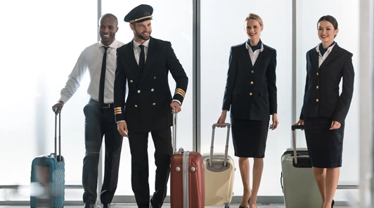 Flight crew in uniform moving through airport highlighting Airline Crew Transportation Chicago