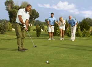 Group of four enjoying a day on the green, highlighting the convenience of Golf Transportation Chicago